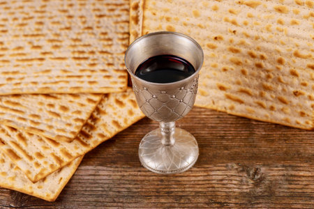 Jewish holiday table for Passover with matzah and metallic cup for kosher wine.の写真素材