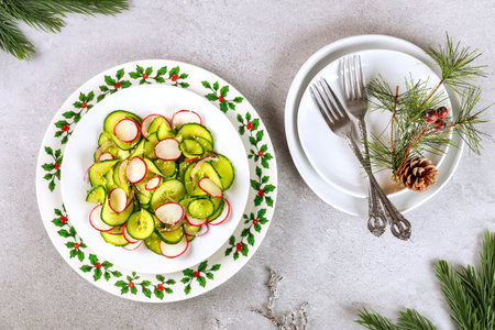 Christmas healthy salad with white table setting and decorations.の写真素材