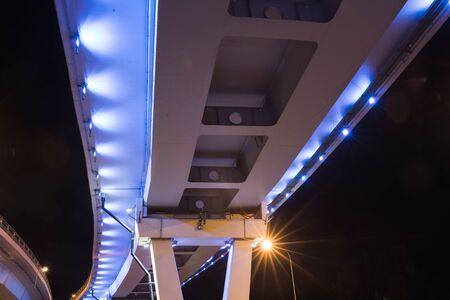 reflection of the bridge at nightの写真素材