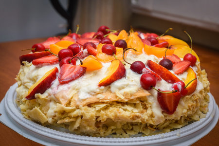 cream dessert with peach and cherry
