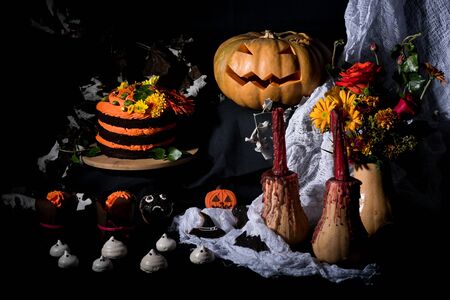 october decorations with pumpkin and cakeの写真素材