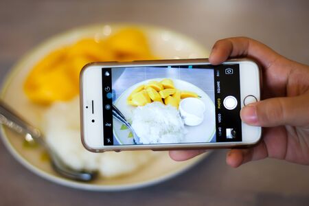 Overlapping images of  mango and sticky rice.の写真素材