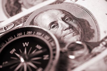 Compass on hundred dollar backgroundの写真素材