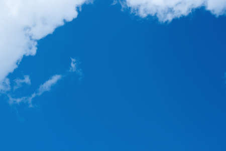 White clouds in a blue skyの写真素材