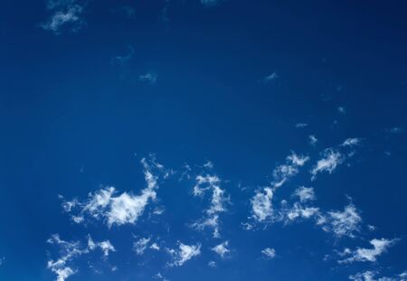 White clouds in a blue skyの写真素材