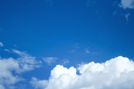 White clouds in a blue skyの写真素材