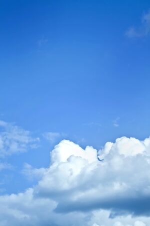 White clouds in a blue skyの写真素材