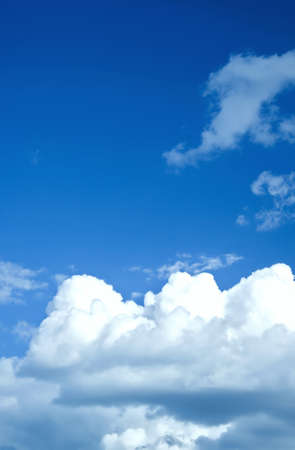 White clouds in a blue skyの写真素材