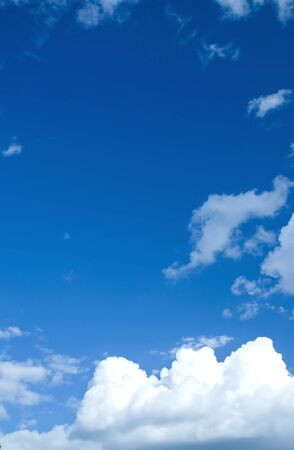 White clouds in a blue skyの写真素材