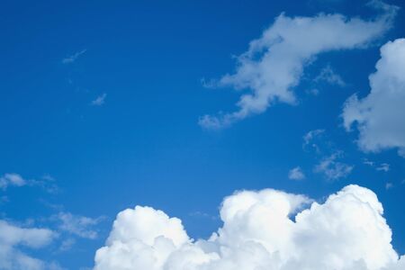 White clouds in a blue skyの写真素材
