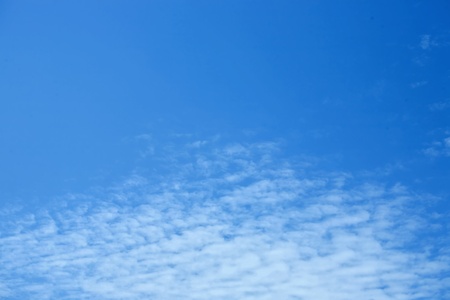 White clouds in a blue skyの写真素材