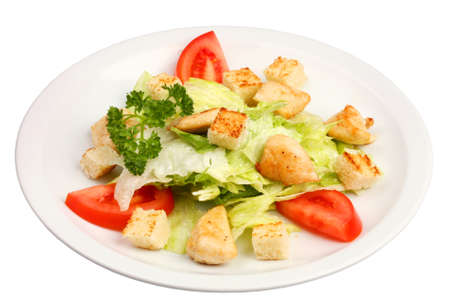 A classic chicken caesar salad with vegetablesの写真素材