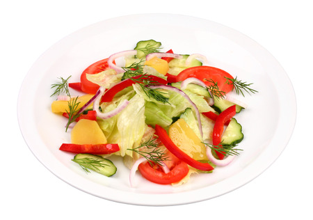 Mixed vegetable salad on white plateの写真素材