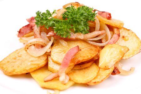 Roasted potatoes with meat, parsley and onionの写真素材