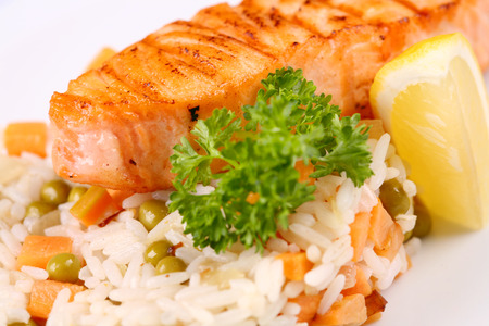 grilled salmon with mixed vegetable and lemonの写真素材