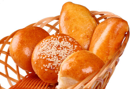 Basket of fresh baked rolls on white backgroundの写真素材