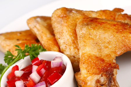 Plate of chicken wings and vegetablesの写真素材