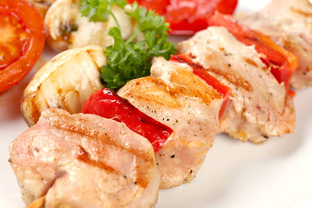 Grilled chicken and pepper on skewersの写真素材