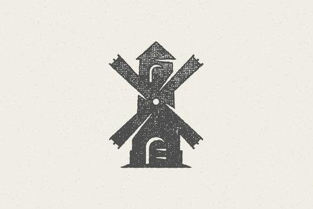 Black silhouette of vintage windmill designed for farming industry hand drawn stamp effect vector...