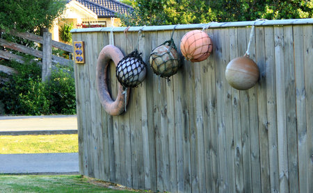 Wooden fence decorated with fishing floats