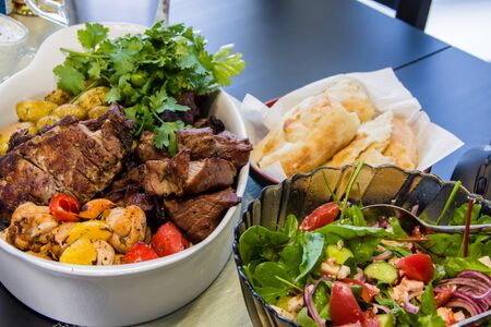 Grilled meat and fresh vegetable salad for lunchの写真素材