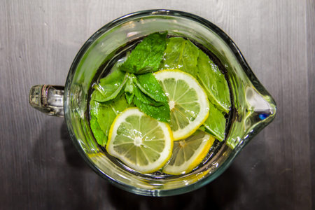 Pitcher with mint-lemon water and iceの写真素材