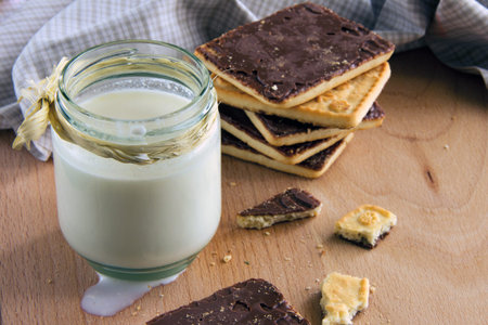 Milk splash and cookies with chocolate high angle viewの写真素材