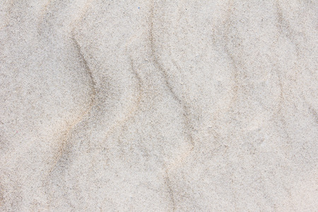Background, texture, wave pattern of oceanic sand on the beach, pastelの写真素材