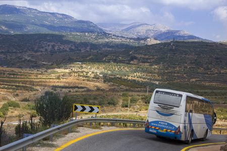 Jerusalem, Israel- 10/20/2017: Tourist bus carries passengers by the mountain road to the Golan Heights, Israelのeditorial素材