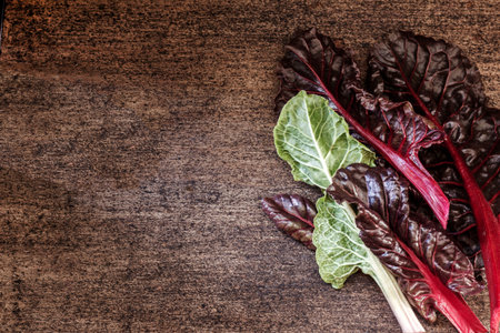 Table top view fresh organic green food. Vegetable healthy green leaves. Swiss chard on wooden...