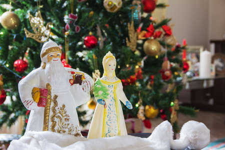 Traditional symbols of the Russian New Year are Santa Claus and Snow Maiden. Vintage Christmas toys. The atmosphere of childhood, New Years miraclesの写真素材