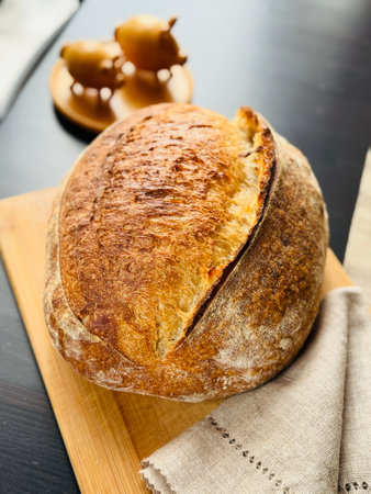 freshly baked sourdough bread with a textured, golden crust.の写真素材