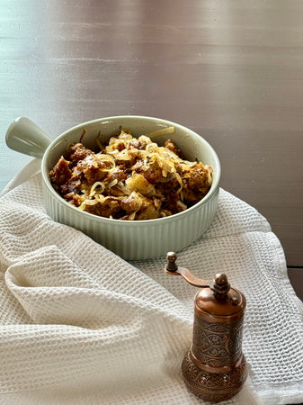 Delicious fried chicken or beef liver with salt, spices and herbs in a ceramic plateの写真素材