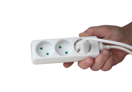 white electric splitter in a hand on a white backgroundの写真素材