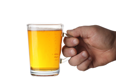a pint of beer kept in a hand on a white backgroundの写真素材