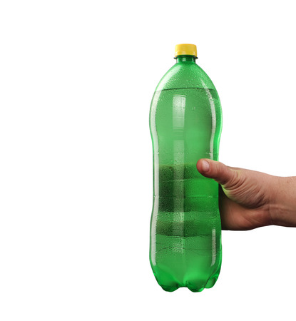 a green plastic bottle with a drink held in your handの写真素材