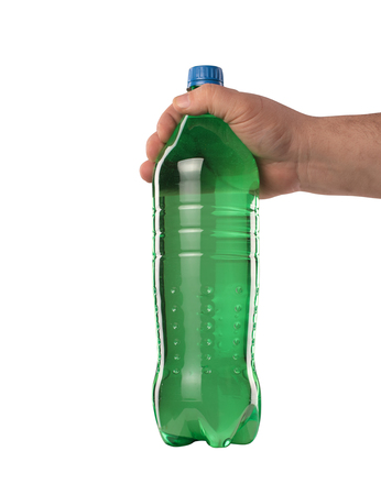 a green plastic bottle with a drink held in your handの写真素材