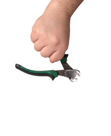 small pincers in a hand on a white backgroundの写真素材