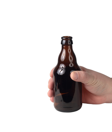 small bottle in hand on a white backgroundの写真素材