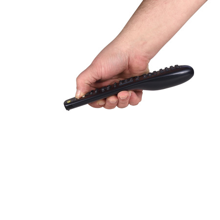 TV remote control held in the palm of your handの写真素材
