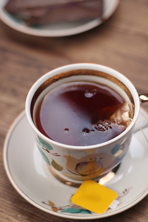 a cup of tea on a table from boardsの写真素材