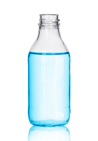 small glass bottle with liquid on a white backgroundの写真素材