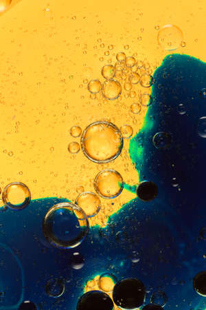 oil bubbles on glass and colored backgroundの写真素材