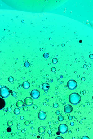oil bubbles on glass and colored backgroundの写真素材