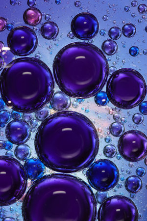 oil bubbles with water on a colored backgroundの写真素材