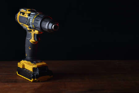 used screwdriver on the table and black backgroundの写真素材
