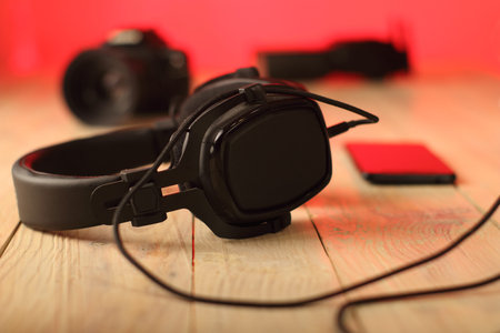 studio headphones on a table with a cable and a colored backgroundの写真素材