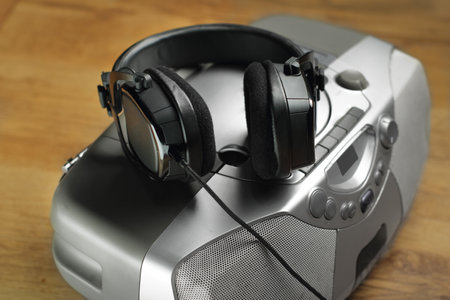 stereo earphones on old radio with wireの写真素材