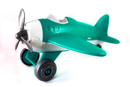 toy airplane with a propeller without a pilot on a white background