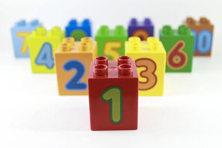 multi-colored plastic constructor with numbers 1, 2, 3 ... and 10 are arranged one after another in descending order. The development of young children. White background.の写真素材